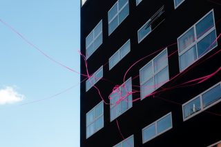 Black Building With Ribbon, a photo by Amber Sexton